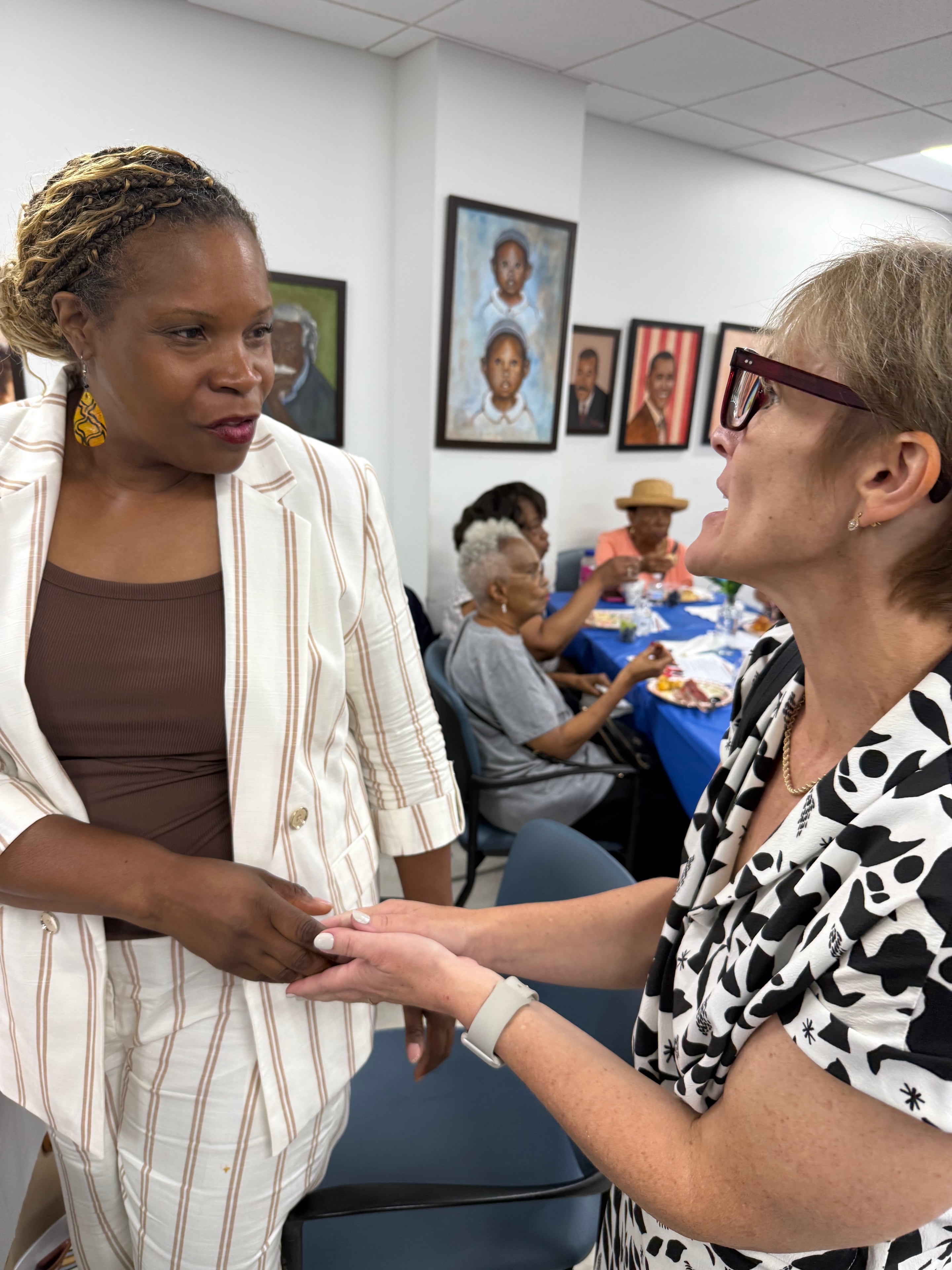 NAACP NYCHA Branch members connecting at an indoor community event