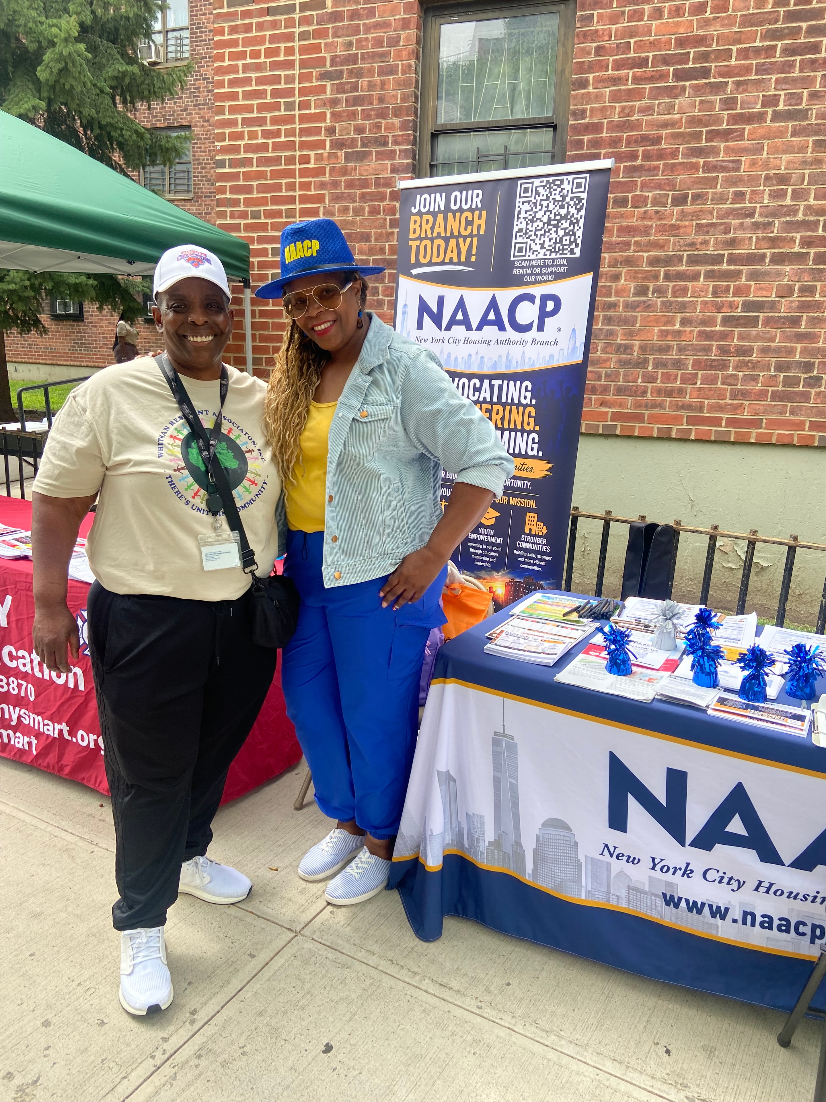 NAACP NYCHA Branch outreach volunteers at an information table
